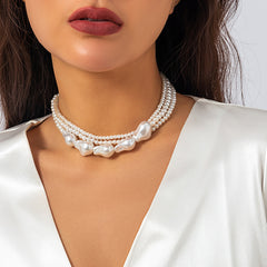 Loookus - Ladies with vintage pearls stacked with woven Baroque ornaments