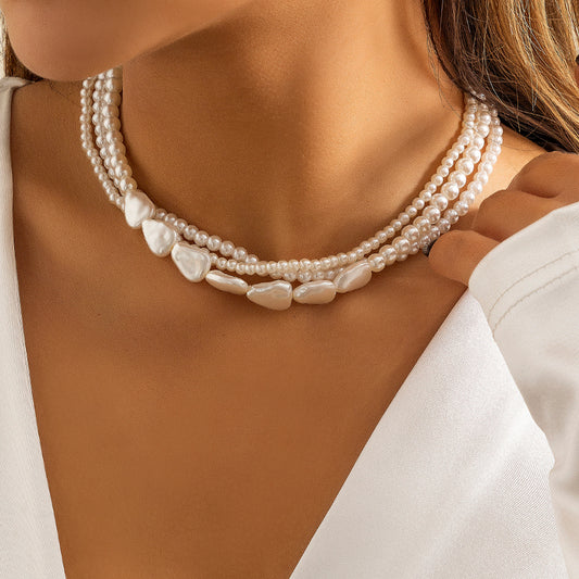 Loookus - Ladies with vintage pearls stacked with woven Baroque ornaments